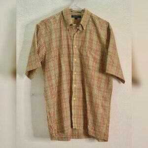 Plaid shirt with mustard yellow and red checkered pattern.